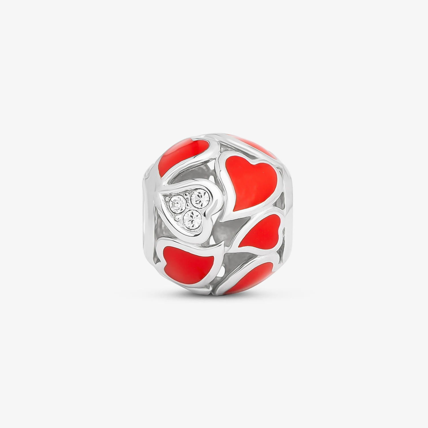 Berlo de prata com detalhes em vermelho e três pedras de cristal formando um coração.