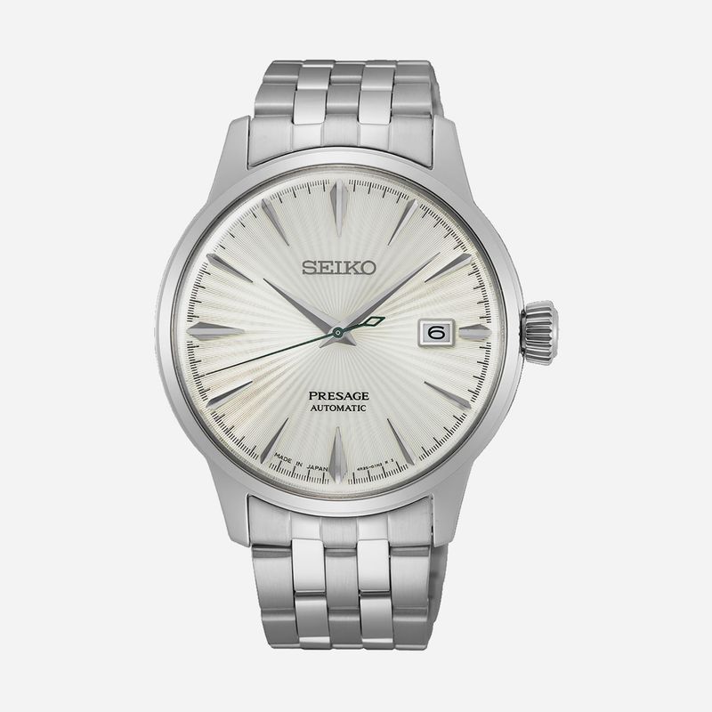 Relógio de pulso da Seiko, modelo Presage automático com mostrador em tom claro, índices e ponteiros prateados, calendário às 3 horas e pulseira de aço inoxidável.