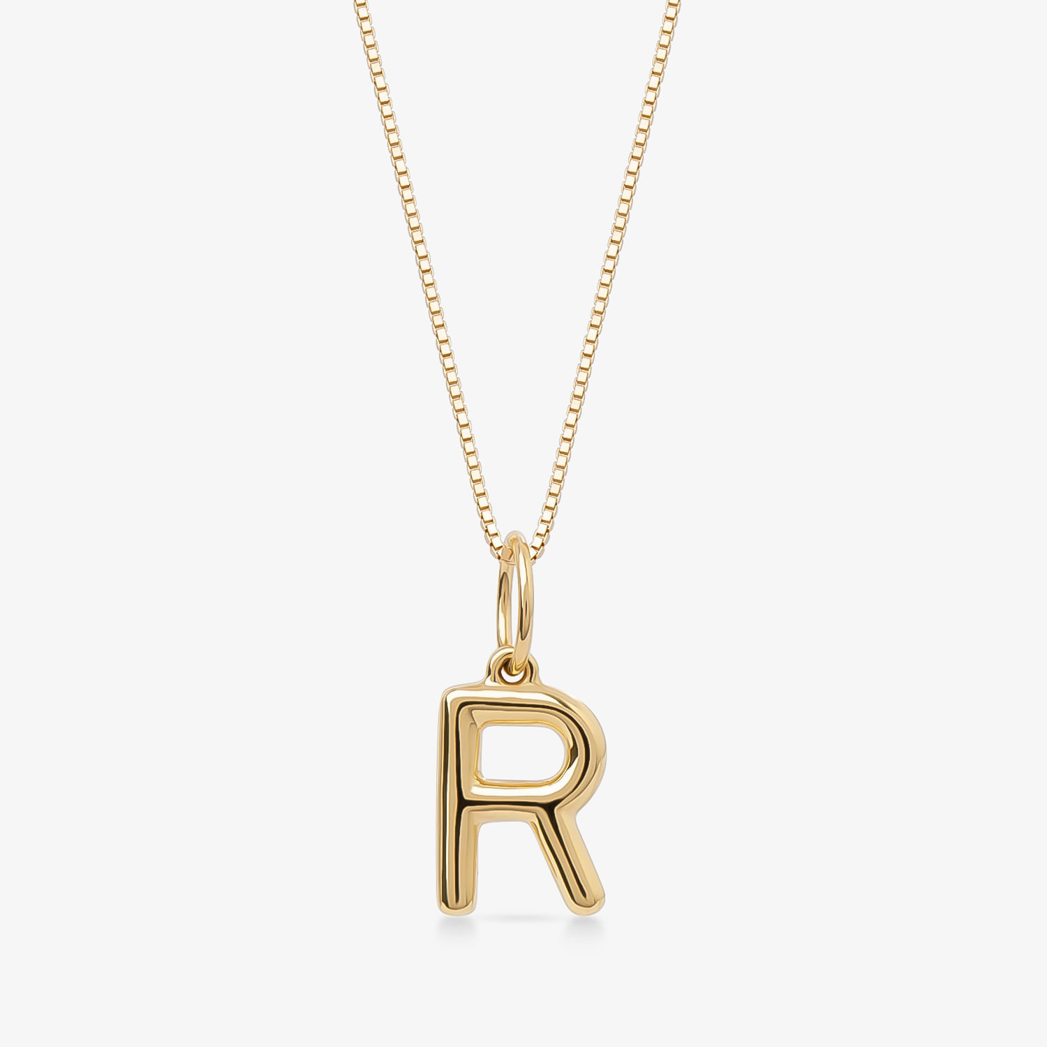 Colar com pingente de letra R dourado em corrente fina, estilo minimalista e elegante.