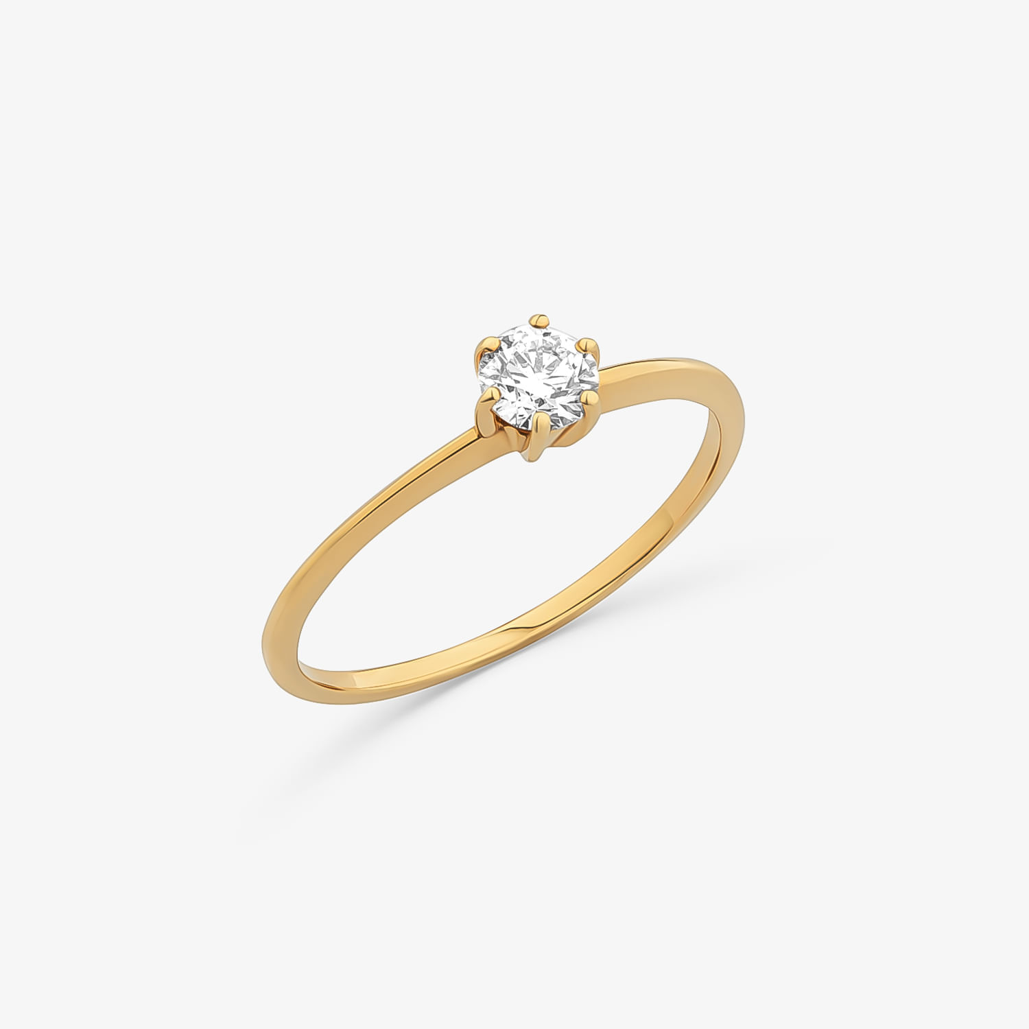 Anel de ouro com diamante solitário em uma configuração de garras.