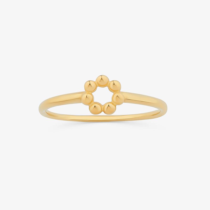 Anel minimalista de ouro com uma fita de pequenas bolas formando um círculo.